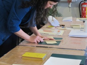 Instructor demonstrating how to make a four flap enclosure