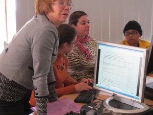 Students are discussing preservation needs and recording on the computer