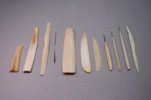 Raw materials -- elk bone & needles -- (left) shaped into bone folders (right)