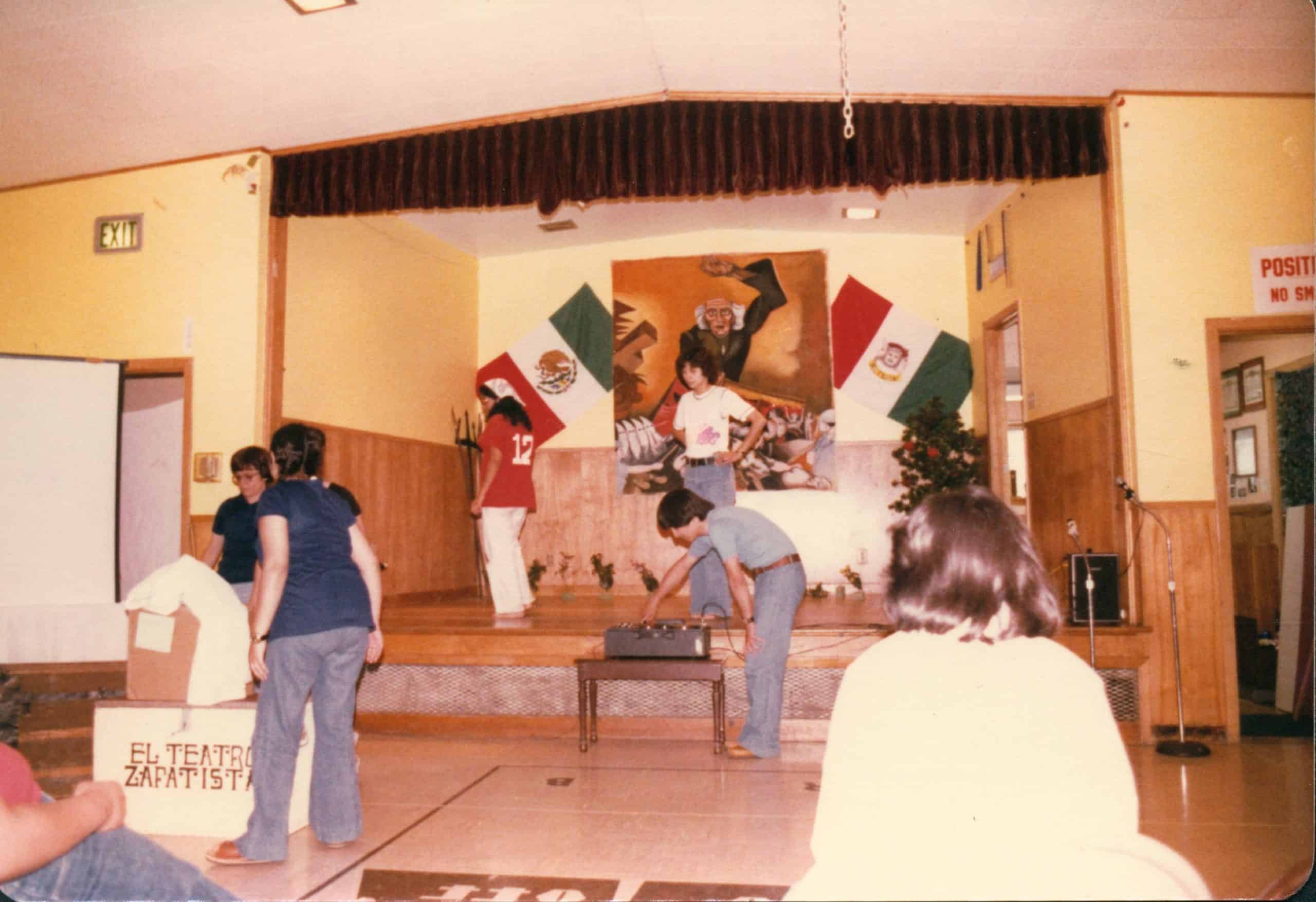 Students setting up on stage in preparation for a performance.