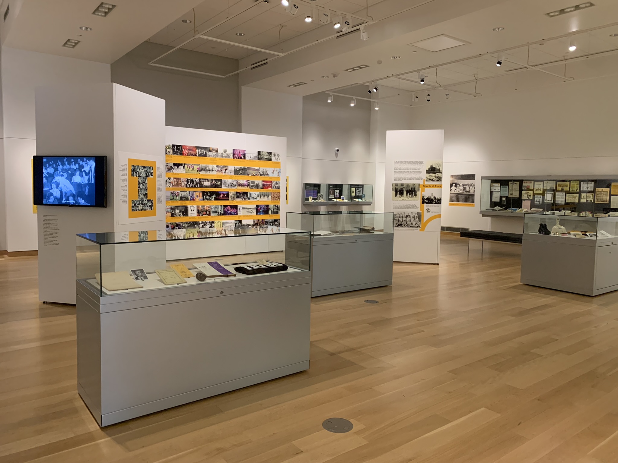 A broad view of the exhibit in the Main Library Gallery. Display cases are seen at a distance.