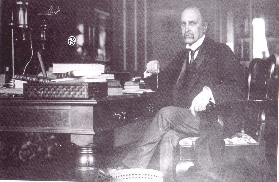 Sir William Osler at the desk that now resides in the John Martin Rare Book Room
