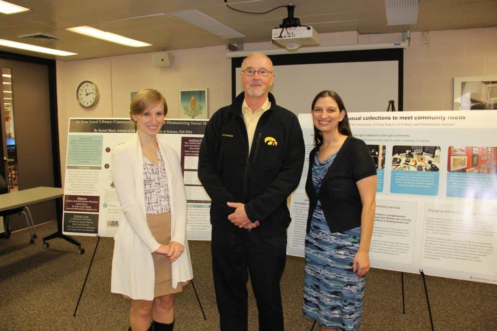 Two SLIS students at their poster sessions