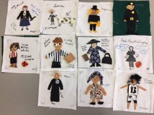 Quilt squares about Iowa women, by Iowa girls.