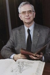 photo of Dick Eimas with 2 rare books