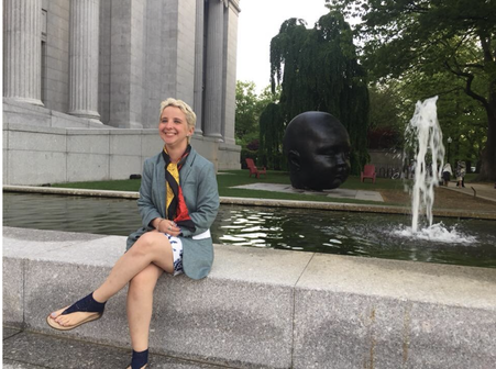 photo of Carlisle Isley, white woman, in front of art and fountain