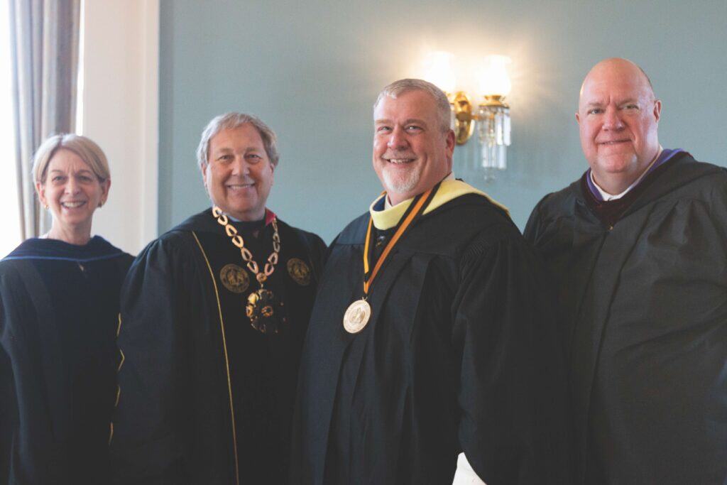 Four people celebrate Culshaw's investiture as the Libraries first endowed position—the Jack B. King University Librarian Chair.