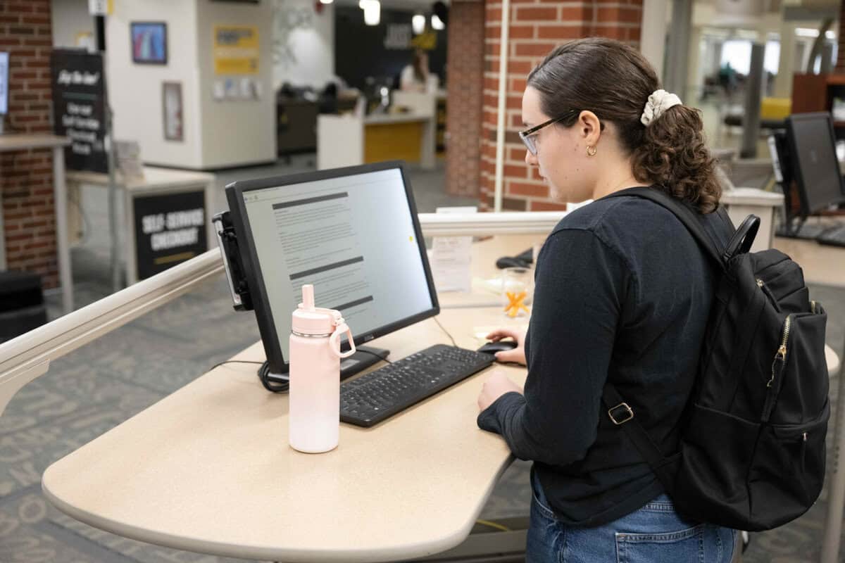 student takes a survey on a computer at the Main Library