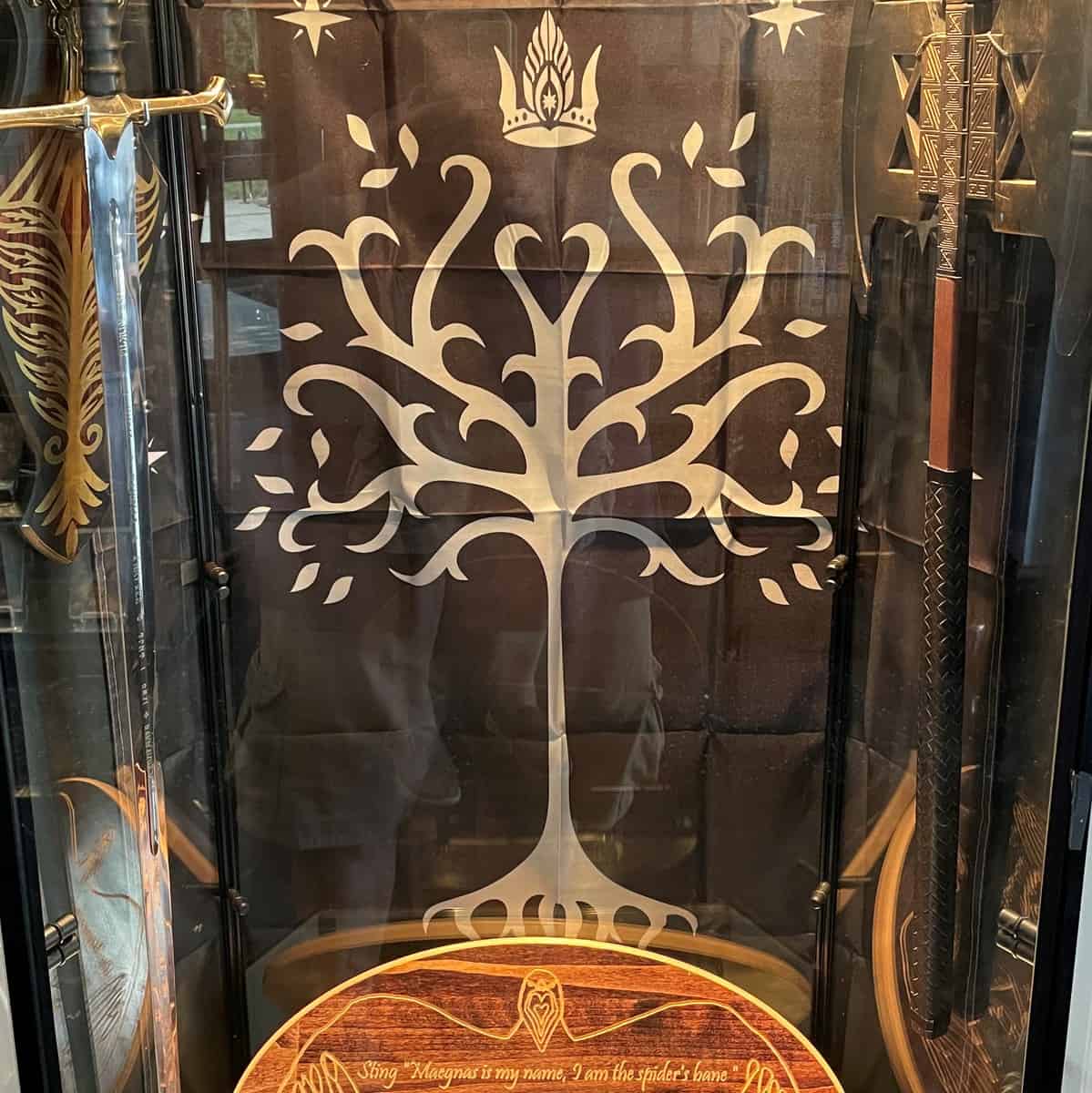 Image of Lord of the Rings swords, banner, and plaque