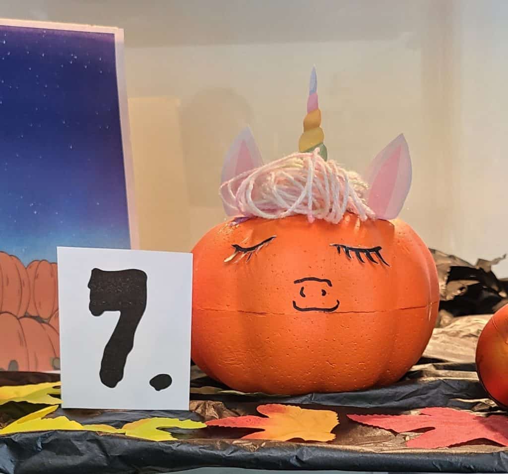 Pumpkin decorated to look like a unicorn