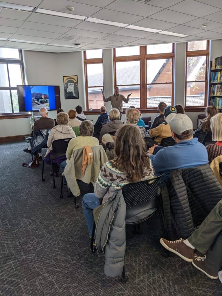 Image of presenter and audience