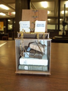 several tiny books chained to a stand