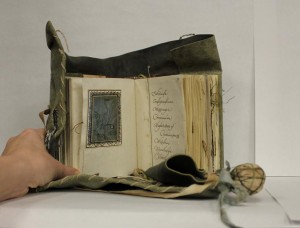 Small parchment book with leater girdle book binding
