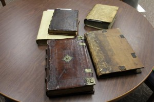 Five 15th century books on a table