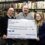 Special Collections staff with an oversized check