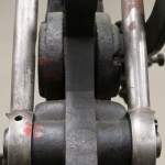 Close up view of the gears of a hand press