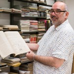 Image of Peter Balestrieri holding zines