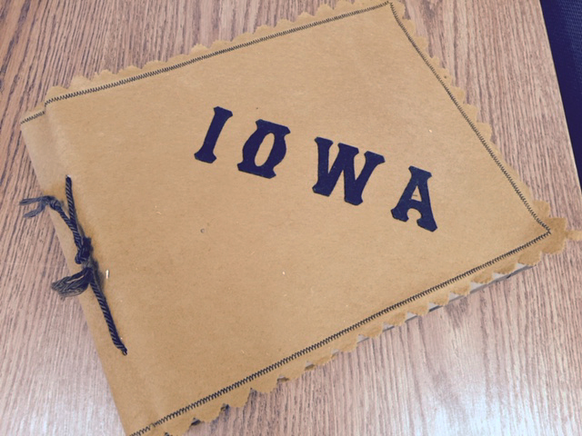 Image of scrapbook with "Iowa" written on the front