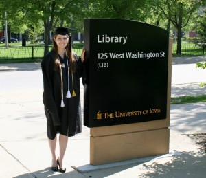 photo of Lindsay Moen standing next to the library