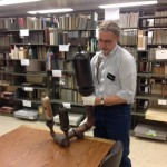 Archivist holding a steam plant whistle