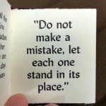 Page from a book with quote "Do not make a mistake, let each one stand it its place."