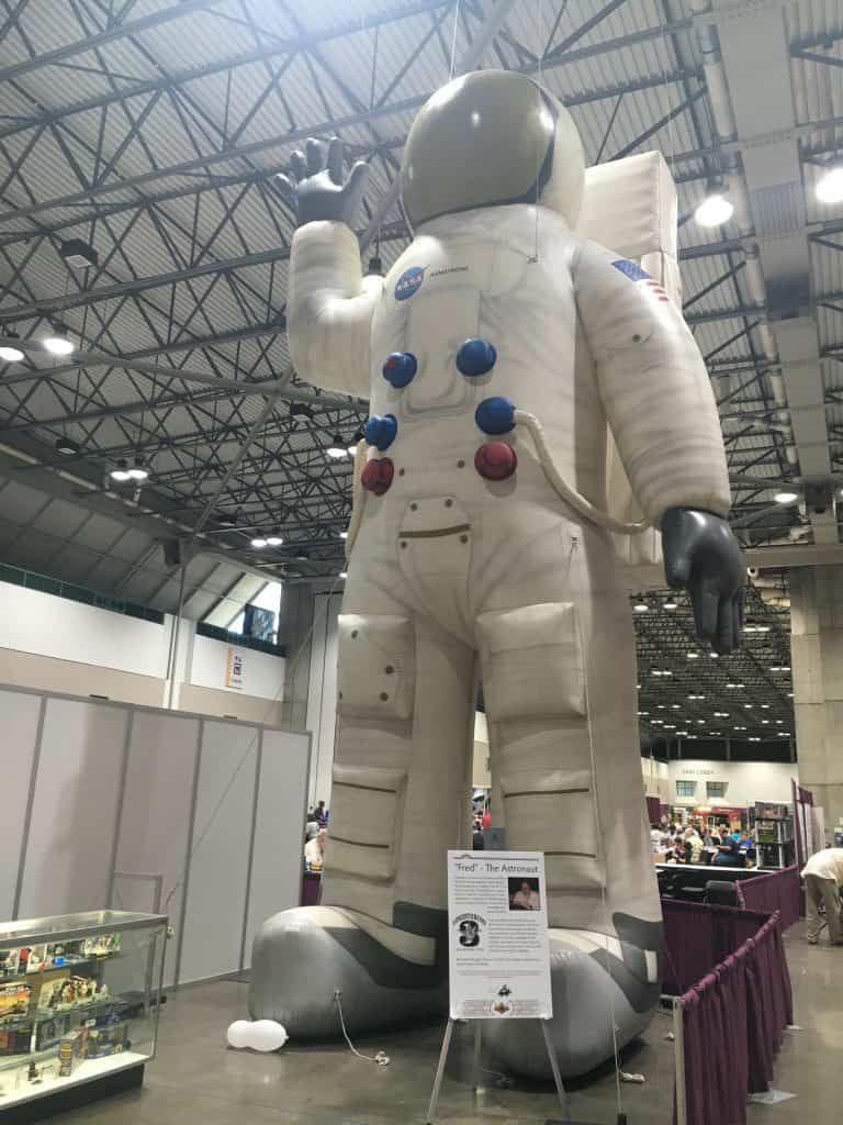 Astronaut inside the dealer's room at World Con