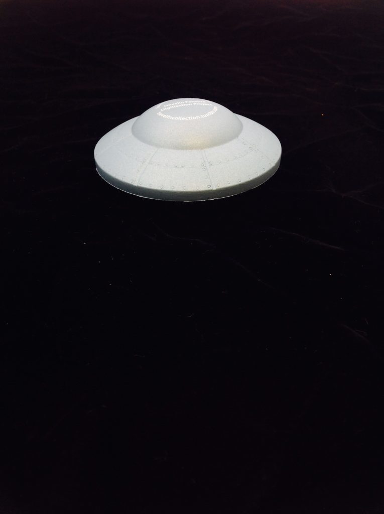 Hevelin Flying Saucer Stress toy that was given away at World Con