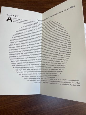 Words forming a circle on two page spread