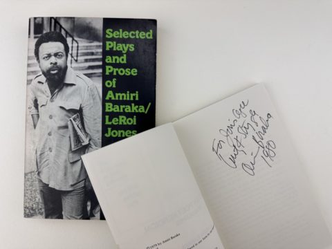 cover of Selected Plays and Prose of Amira Baraka, and open book with inscription next to it