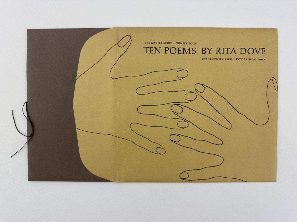 Brown and yellow cover of Ten Poems book