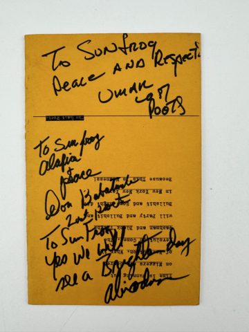 Back cover of Last Poets signed by members