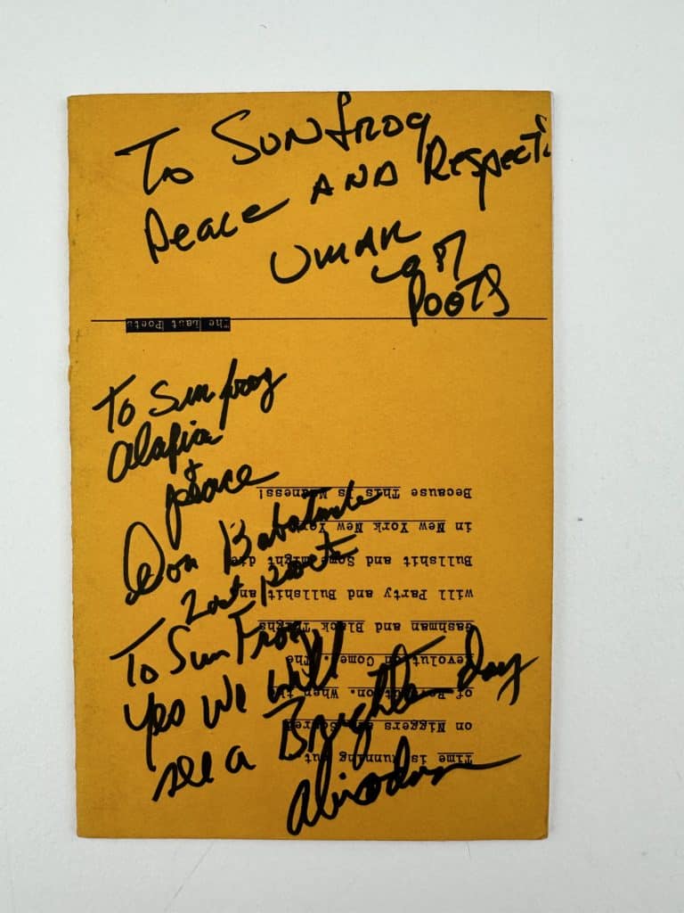Back cover of Last Poets signed by members