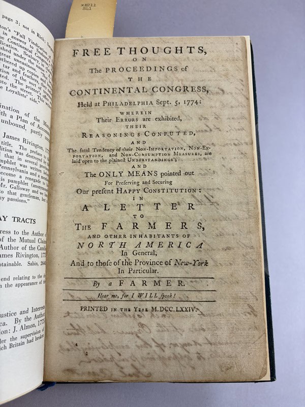 Old book opened to a page that has "Free Thoughts" in large letters