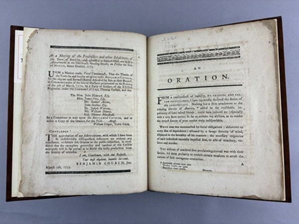 Book opened to page with the word "Oration" as title