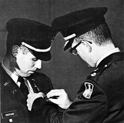 James Deegan receiving medal of valor, Iowa City, Dec. 1966 | University of Iowa Alumni Publications