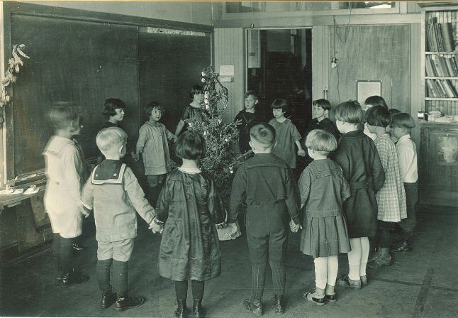 Children around Christmas tree, University of Iowa elementary school, 1920s | Iowa City Town and Campus Scenes